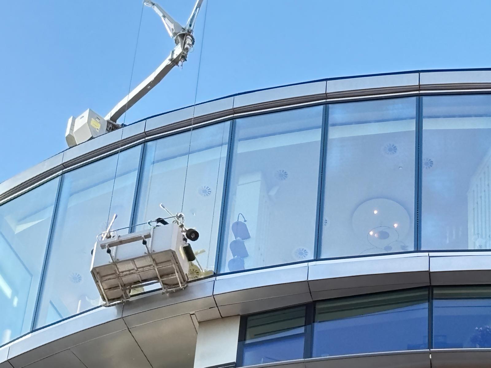 Commercial window cleaning with a cradle, UK Commercial window cleaning with a cradle, UK